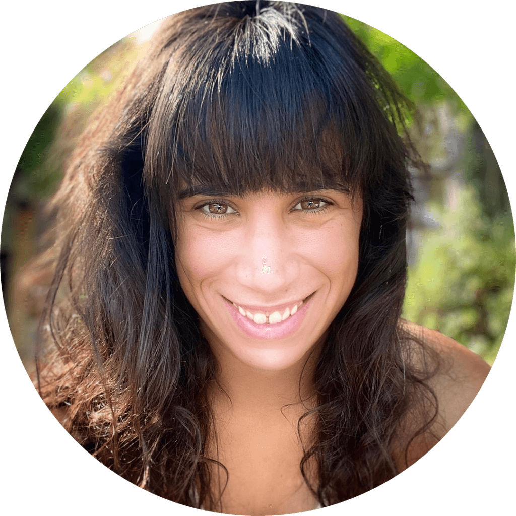 A brown eyed, dark haired woman smiling